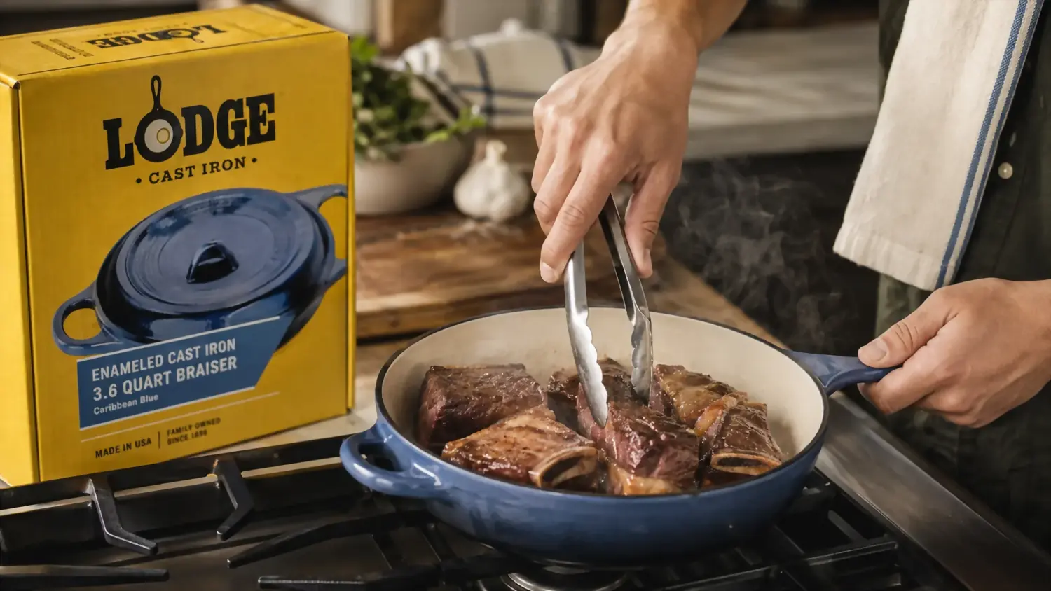 Hands searing short ribs directly in the Lodge braiser on the stovetop